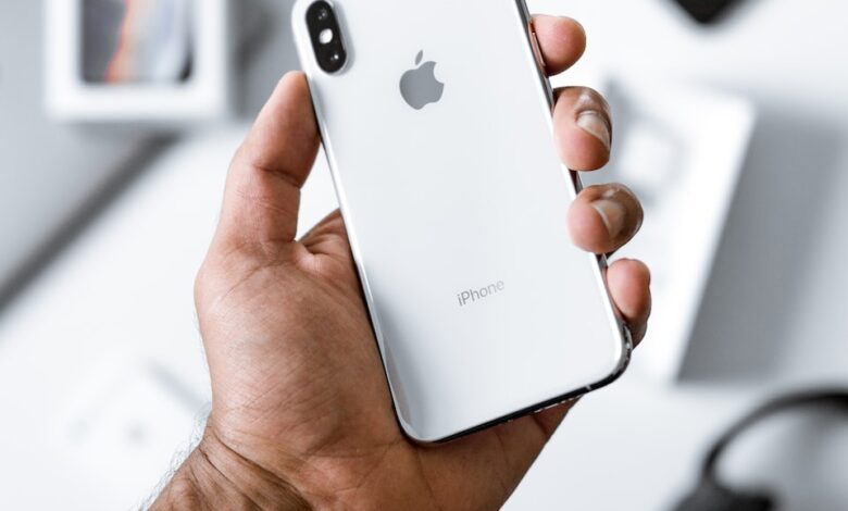 person holding silver iPhone X